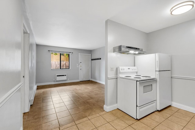 2134 Fairfax Ave Unit A1, Nashville, TN 37212 - kitchen featuring white appliances, range hood, light tile patterned floors, and baseboards
