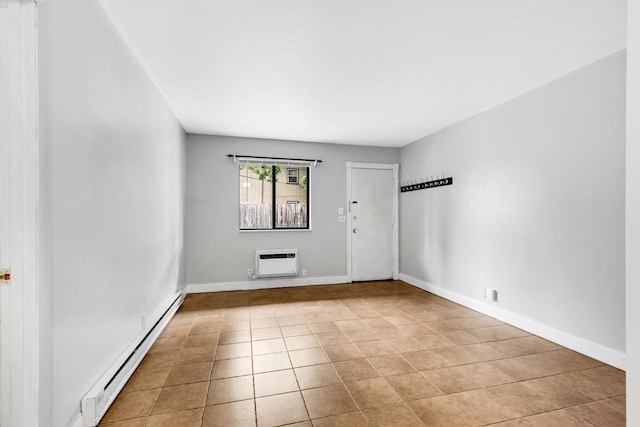 2134 Fairfax Ave Unit A1, Nashville, TN 37212 - unfurnished room with a baseboard heating unit, light tile patterned floors, a wall unit AC, and baseboards