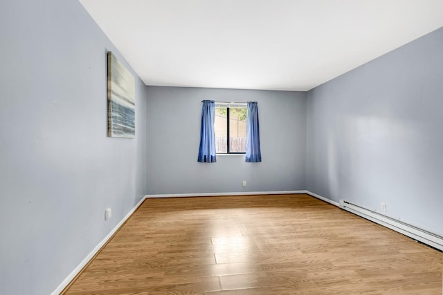 2134 Fairfax Ave Unit A1, Nashville, TN 37212 - spare room with wood finished floors, baseboard heating, and baseboards