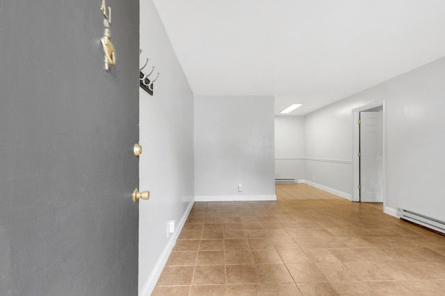 2134 Fairfax Ave Unit A1, Nashville, TN 37212 - unfurnished room featuring a baseboard heating unit, light tile patterned floors, and baseboards