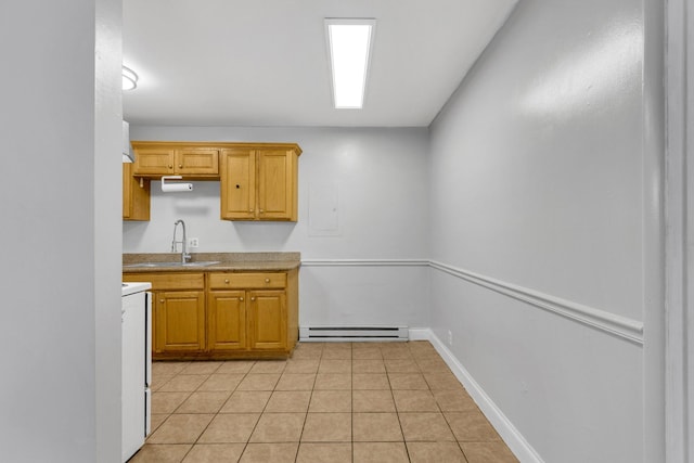 2134 Fairfax Ave Unit A1, Nashville, TN 37212 - kitchen with a baseboard radiator, a sink, light tile patterned flooring, stove, and baseboards