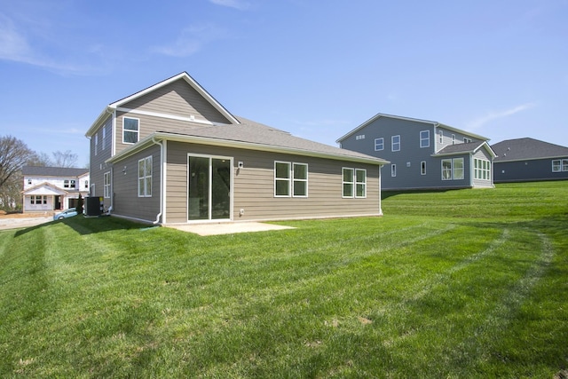 2367 Williamsport Lndg, Columbia, TN 38401 - back of house with central AC, a lawn, and a patio