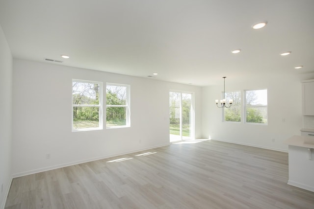 2367 Williamsport Lndg, Columbia, TN 38401 - unfurnished living room with a chandelier, light wood-type flooring, recessed lighting, and baseboards
