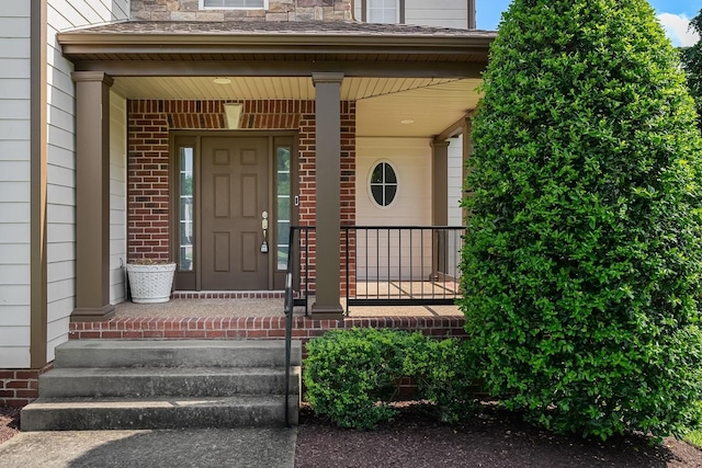 217 Karen Dr, Mount Juliet, TN 37122 - doorway to property featuring covered porch and brick siding