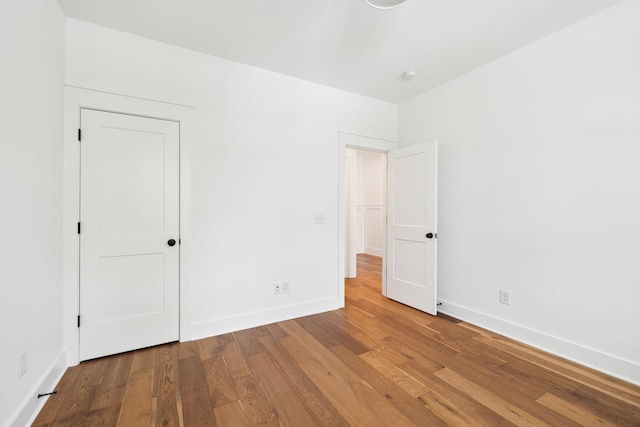 3298 Vinemont Dr, Thompsons Station, TN 37179 - unfurnished bedroom with wood finished floors and baseboards