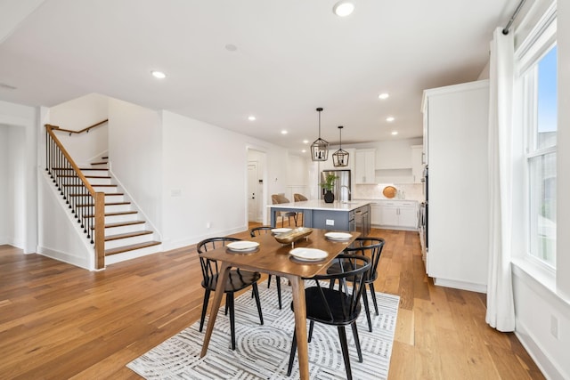 3298 Vinemont Dr, Thompsons Station, TN 37179 - dining room featuring stairs, plenty of natural light, light wood-style flooring, recessed lighting, and baseboards