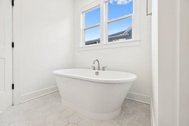 3298 Vinemont Dr, Thompsons Station, TN 37179 - full bathroom featuring baseboards, a freestanding bath, and tile patterned floors