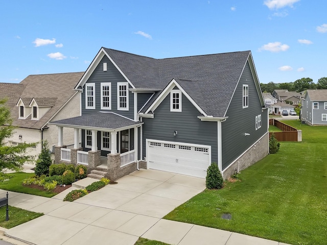3298 Vinemont Dr, Thompsons Station, TN 37179 - view of front of home with an attached garage, covered porch, concrete driveway, a front yard, and a shingled roof