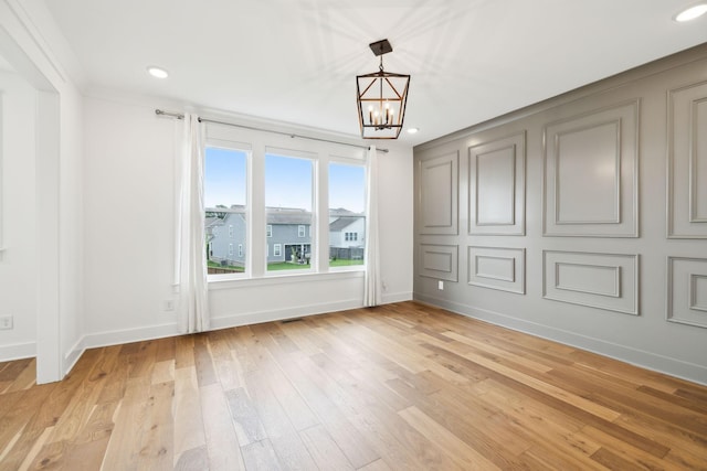 3298 Vinemont Dr, Thompsons Station, TN 37179 - unfurnished bedroom with a chandelier, light wood-style floors, recessed lighting, and baseboards