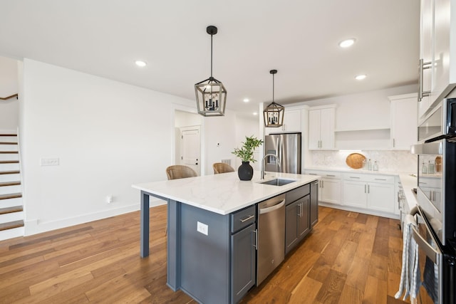3298 Vinemont Dr, Thompsons Station, TN 37179 - kitchen with appliances with stainless steel finishes, a sink, open shelves, white cabinetry, and recessed lighting