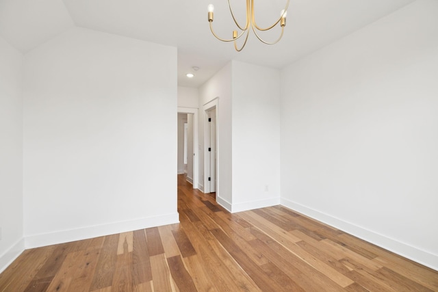 3298 Vinemont Dr, Thompsons Station, TN 37179 - spare room with a chandelier, wood finished floors, baseboards, and recessed lighting