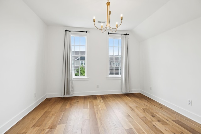 3298 Vinemont Dr, Thompsons Station, TN 37179 - empty room featuring light wood finished floors, a chandelier, and baseboards
