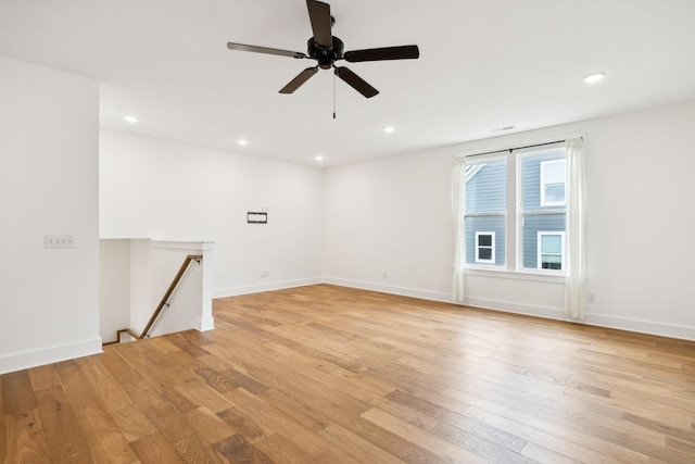 3298 Vinemont Dr, Thompsons Station, TN 37179 - empty room with light wood finished floors, ceiling fan, recessed lighting, and baseboards