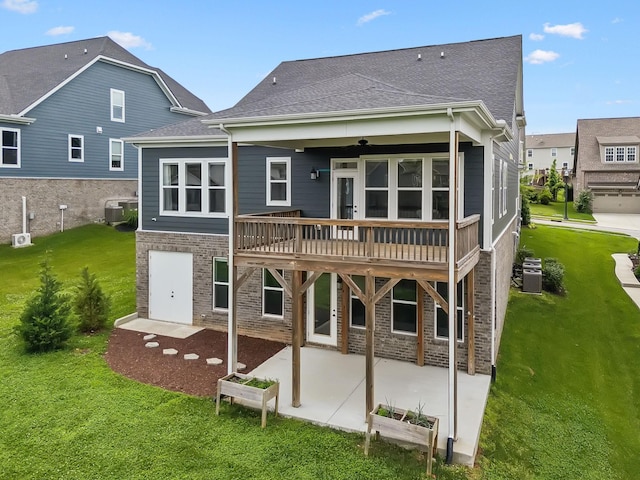 3298 Vinemont Dr, Thompsons Station, TN 37179 - rear view of house featuring a yard, a patio, a deck, central AC, and brick siding