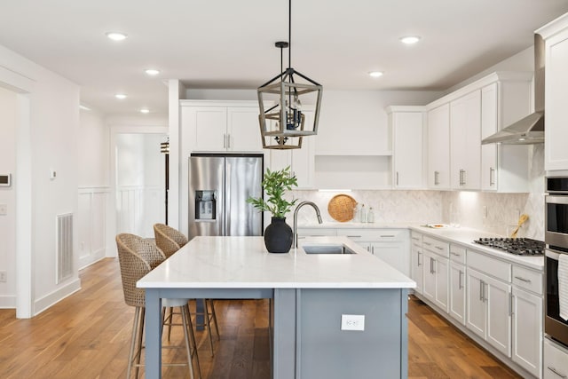 3298 Vinemont Dr, Thompsons Station, TN 37179 - kitchen with appliances with stainless steel finishes, a sink, open shelves, a kitchen breakfast bar, and backsplash