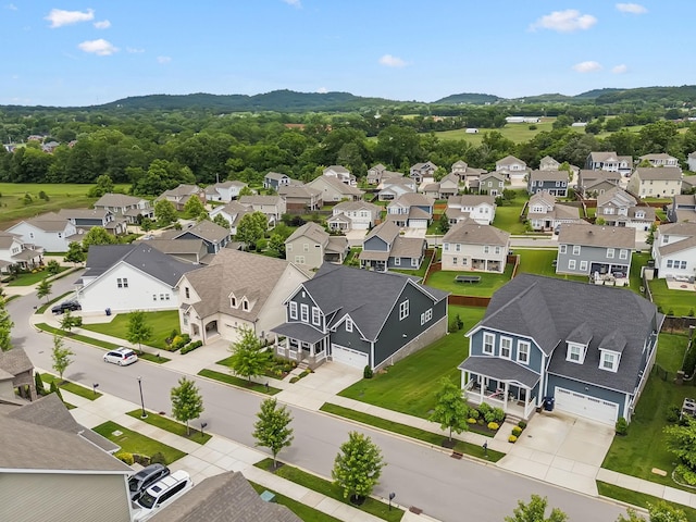 3298 Vinemont Dr, Thompsons Station, TN 37179 - aerial perspective of suburban area with a mountain backdrop