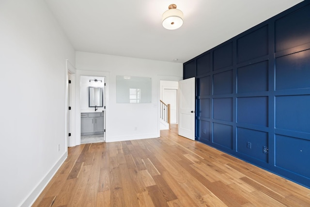 3298 Vinemont Dr, Thompsons Station, TN 37179 - unfurnished bedroom with light wood-style flooring, baseboards, and ensuite bath