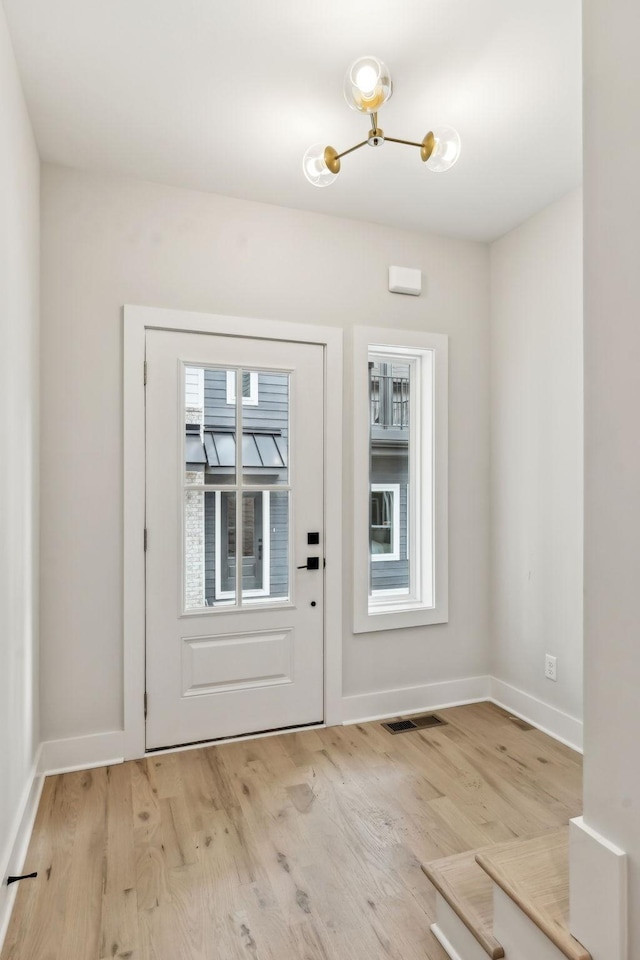 6124 Robertson Ave Unit 3, Nashville, TN 37209 - entrance foyer featuring light wood-style flooring, a chandelier, and baseboards