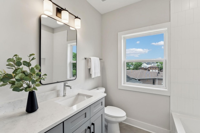 6124 Robertson Ave Unit 3, Nashville, TN 37209 - bathroom featuring healthy amount of natural light, vanity, a tub to relax in, and toilet