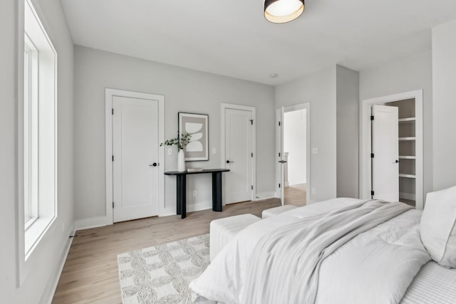 6124 Robertson Ave Unit 3, Nashville, TN 37209 - bedroom with light wood-style floors, baseboards, and two closets