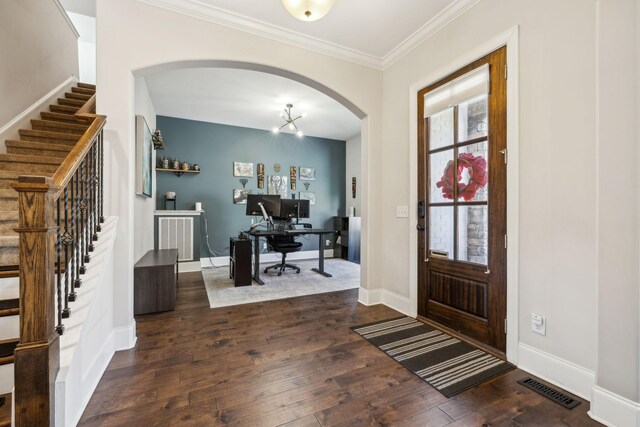 413 Eagle Rdg, Nashville, TN 37209 - foyer entrance featuring arched walkways, stairs, dark wood-style flooring, ornamental molding, and baseboards