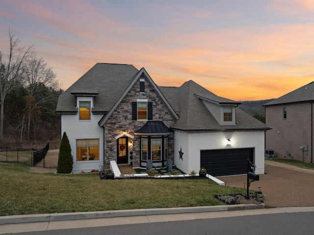413 Eagle Rdg, Nashville, TN 37209 - view of front of home featuring a garage, roof with shingles, stucco siding, and concrete driveway