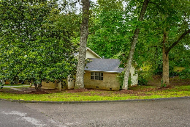 4510 Ravenwood Dr E, Chattanooga, TN 37415 - view of side of property featuring crawl space and roof with shingles