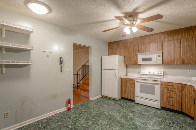4510 Ravenwood Dr E, Chattanooga, TN 37415 - kitchen with white appliances, brown cabinets, a ceiling fan, light countertops, and a textured ceiling