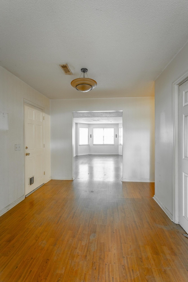 4510 Ravenwood Dr E, Chattanooga, TN 37415 - hall featuring wood finished floors, baseboards, and a textured ceiling