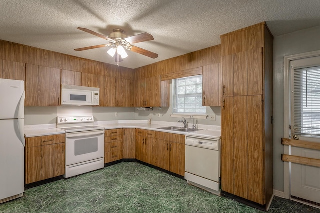 4510 Ravenwood Dr E, Chattanooga, TN 37415 - kitchen with white appliances, a sink, light countertops, a ceiling fan, and a textured ceiling