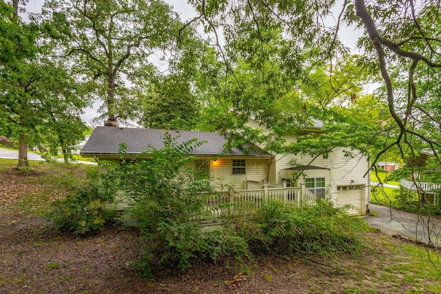 4510 Ravenwood Dr E, Chattanooga, TN 37415 - back of property featuring an attached garage, concrete driveway, and a chimney