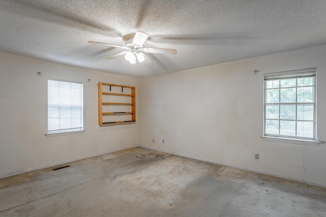 4510 Ravenwood Dr E, Chattanooga, TN 37415 - unfurnished room with plenty of natural light, ceiling fan, a textured ceiling, light colored carpet, and baseboards