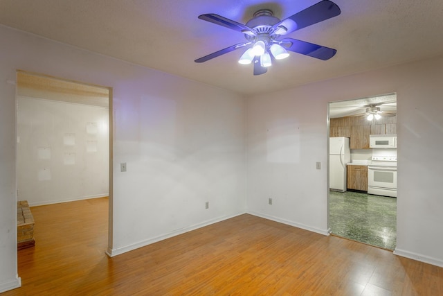 4510 Ravenwood Dr E, Chattanooga, TN 37415 - unfurnished room with a ceiling fan, light wood finished floors, and baseboards