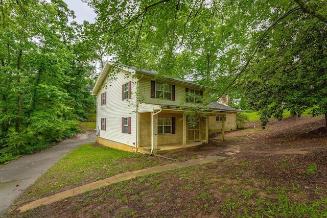 4510 Ravenwood Dr E, Chattanooga, TN 37415 - traditional home featuring a porch and brick siding