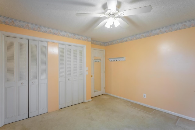 4510 Ravenwood Dr E, Chattanooga, TN 37415 - unfurnished bedroom with carpet flooring, baseboards, ceiling fan, and a textured ceiling