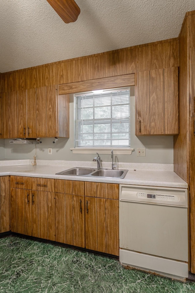 4510 Ravenwood Dr E, Chattanooga, TN 37415 - kitchen with white dishwasher, a sink, a textured ceiling, and brown cabinetry