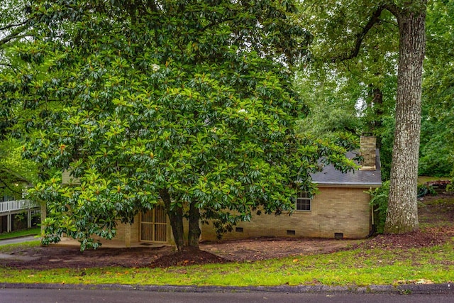 4510 Ravenwood Dr E, Chattanooga, TN 37415 - view of home's exterior featuring crawl space, a chimney, and brick siding