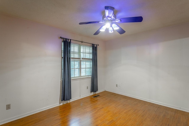 4510 Ravenwood Dr E, Chattanooga, TN 37415 - spare room featuring wood finished floors, a ceiling fan, baseboards, and a textured ceiling