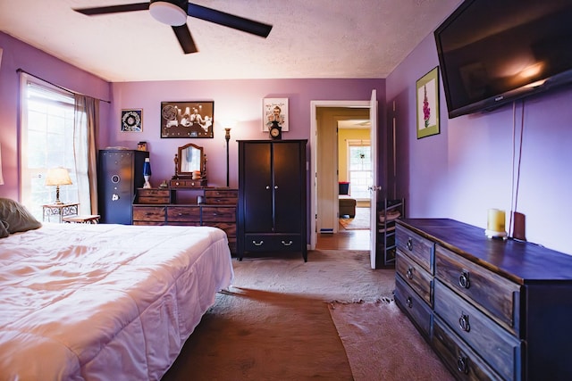 2014 Saddlebrook Dr, Murfreesboro, TN 37129 - bedroom featuring multiple windows, carpet flooring, a textured ceiling, and a ceiling fan