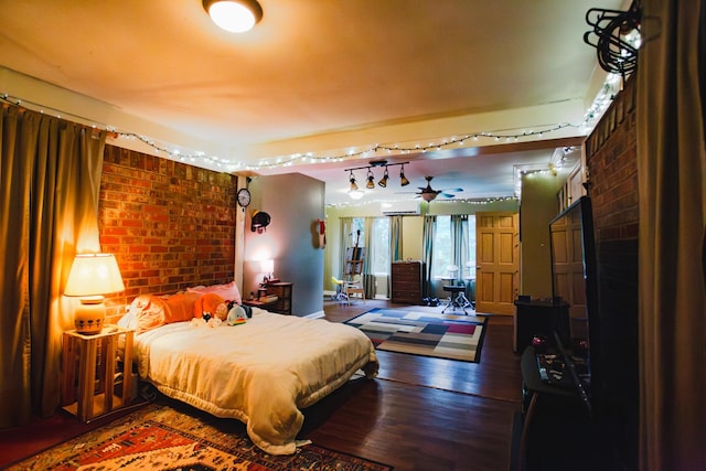 2014 Saddlebrook Dr, Murfreesboro, TN 37129 - bedroom featuring brick wall, wood finished floors, and a wall mounted air conditioner