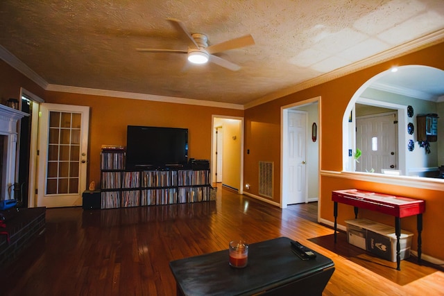 2014 Saddlebrook Dr, Murfreesboro, TN 37129 - living area with a ceiling fan, wood finished floors, arched walkways, crown molding, and a textured ceiling