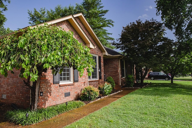 2014 Saddlebrook Dr, Murfreesboro, TN 37129 - view of home's exterior with a yard, brick siding, and crawl space