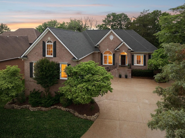 1223 Twelve Stones Xing, Goodlettsville, TN 37072 - view of front of house featuring brick siding, roof with shingles, and concrete driveway