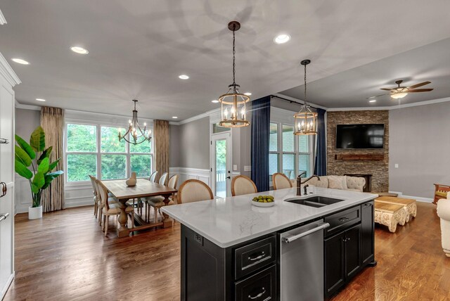 1132 Pretender Way, Columbia, TN 38401 - kitchen featuring dishwasher, ornamental molding, dark cabinetry, open floor plan, and a chandelier