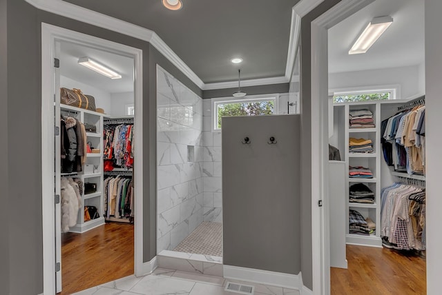 1132 Pretender Way, Columbia, TN 38401 - bathroom featuring a spacious closet, walk in shower, crown molding, recessed lighting, and marble look tile flooring