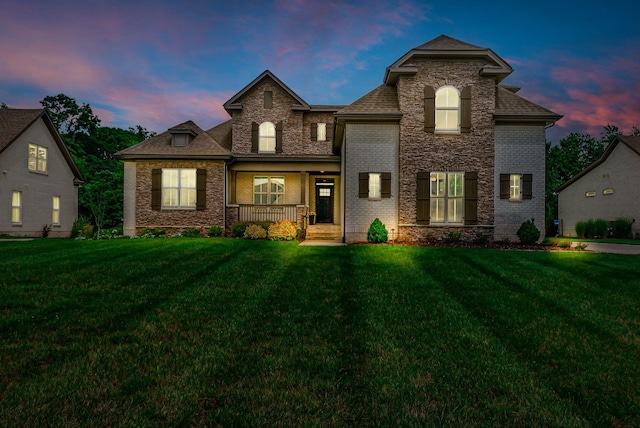 1132 Pretender Way, Columbia, TN 38401 - back of house at dusk with a lawn, a porch, and brick siding