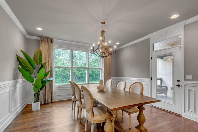 1132 Pretender Way, Columbia, TN 38401 - dining area with a decorative wall, crown molding, a chandelier, a wainscoted wall, and wood finished floors