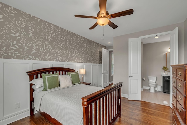 1132 Pretender Way, Columbia, TN 38401 - bedroom featuring wallpapered walls, wainscoting, wood finished floors, recessed lighting, and connected bathroom