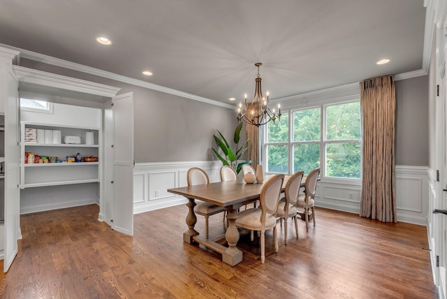 1132 Pretender Way, Columbia, TN 38401 - dining room with a chandelier, a decorative wall, a wainscoted wall, crown molding, and wood finished floors