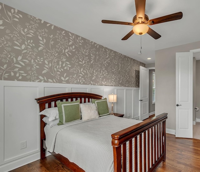1132 Pretender Way, Columbia, TN 38401 - bedroom featuring wallpapered walls, wood finished floors, wainscoting, a decorative wall, and a ceiling fan